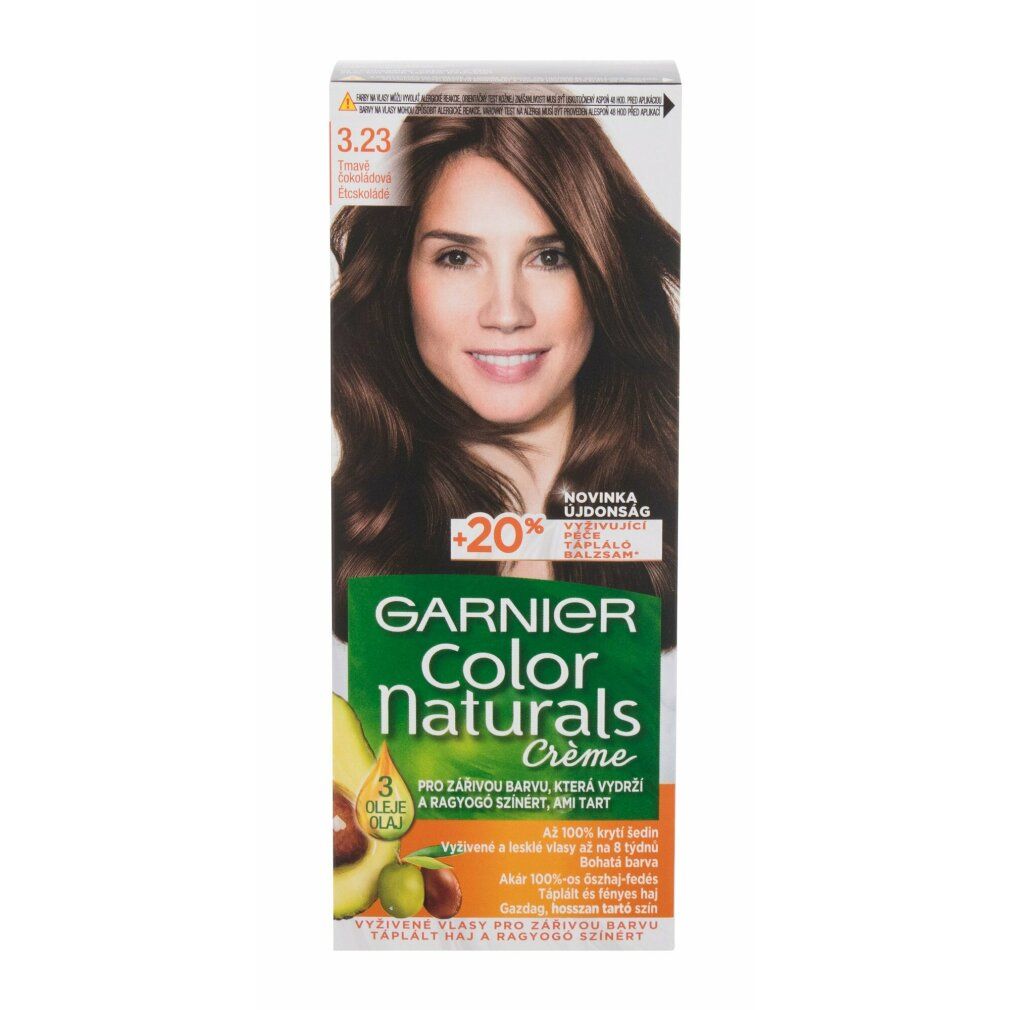 Garnier Color Naturals Créme Packung. Frau mit braunen Haaren. Produktname und Logo sichtbar. Grün-braune Verpackung.