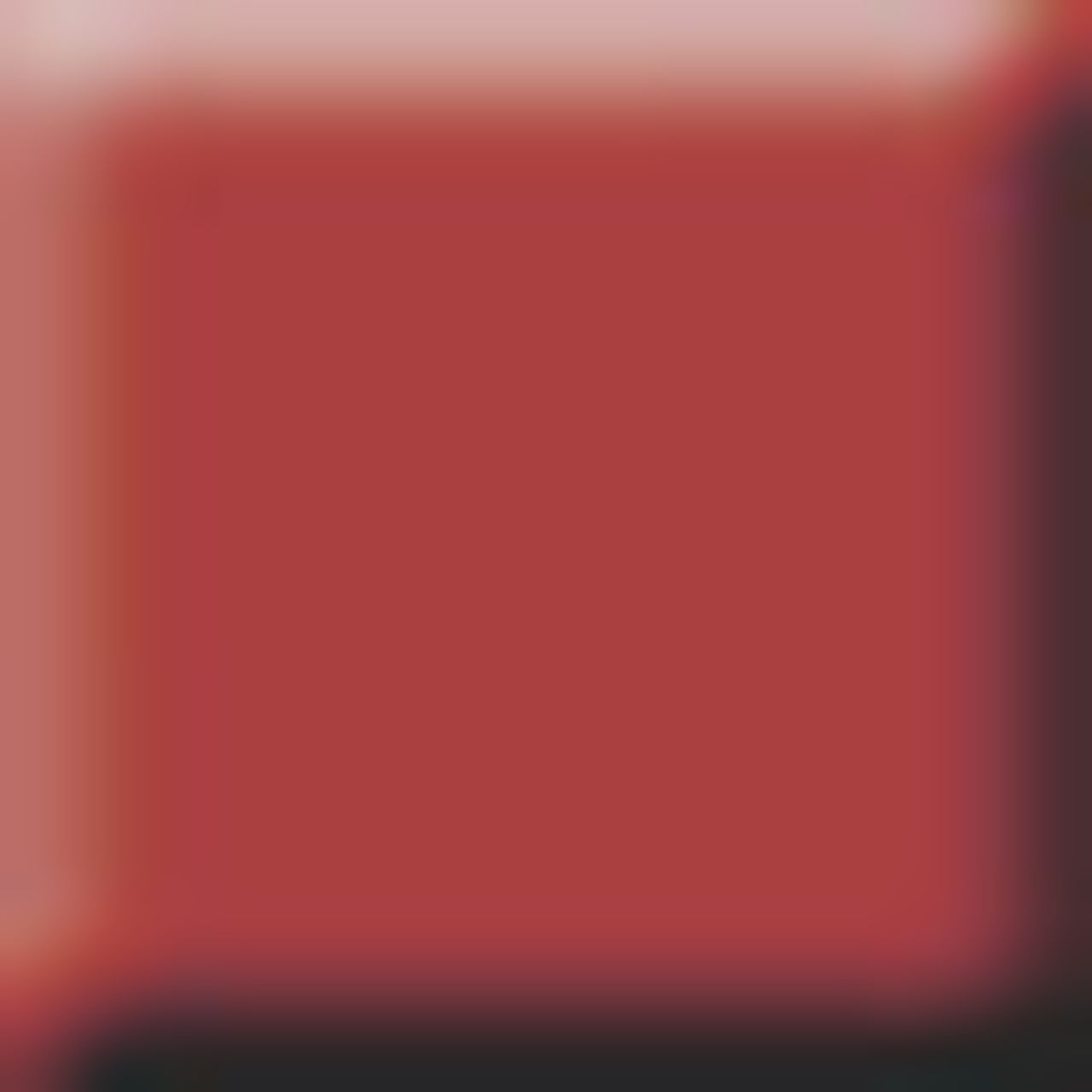 Einfarbiger, roter Hintergrund. Der Hintergrund ist unscharf.