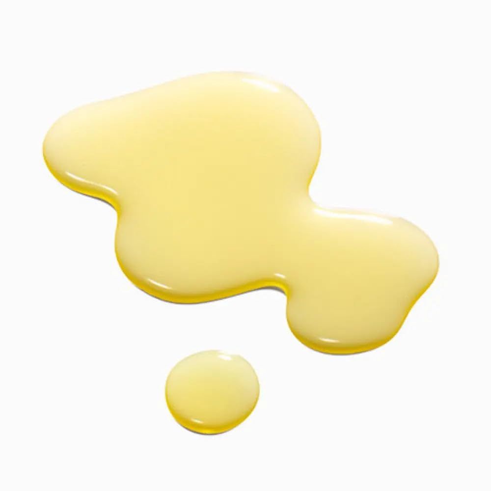 Ein goldgelber Ölfleck auf weißem Hintergrund.