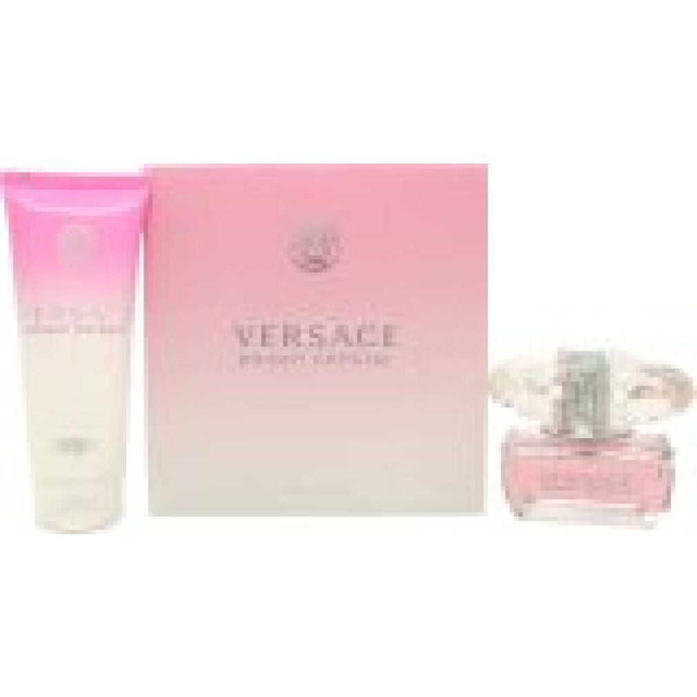 Set mit Parfümflakon, Körperlotion und Schachtel. Rosa Farbverlauf. Versace-Logo und Schriftzug.