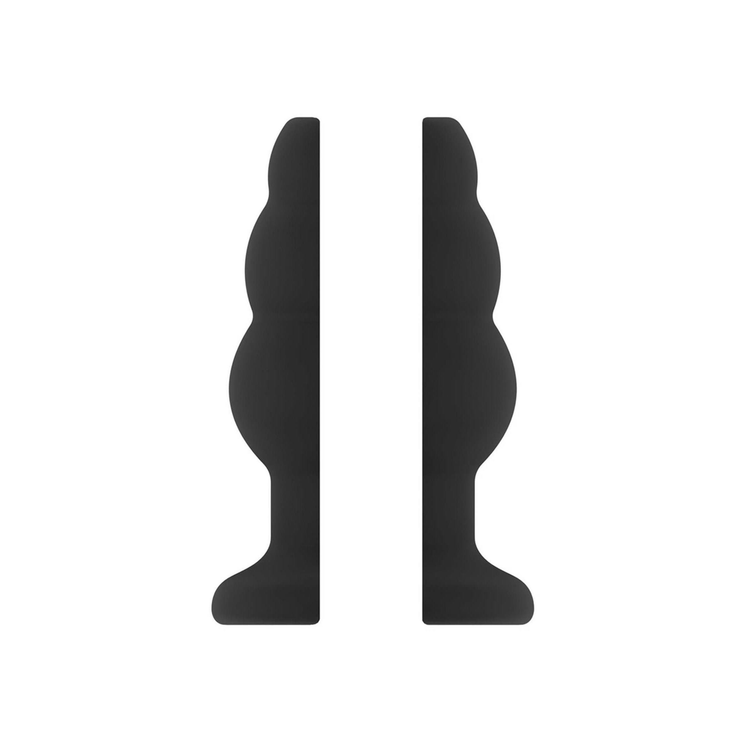 Zwei Hälften eines schwarzen Butt Plugs. Die Form ist geriffelt mit einem breiten Sockel.