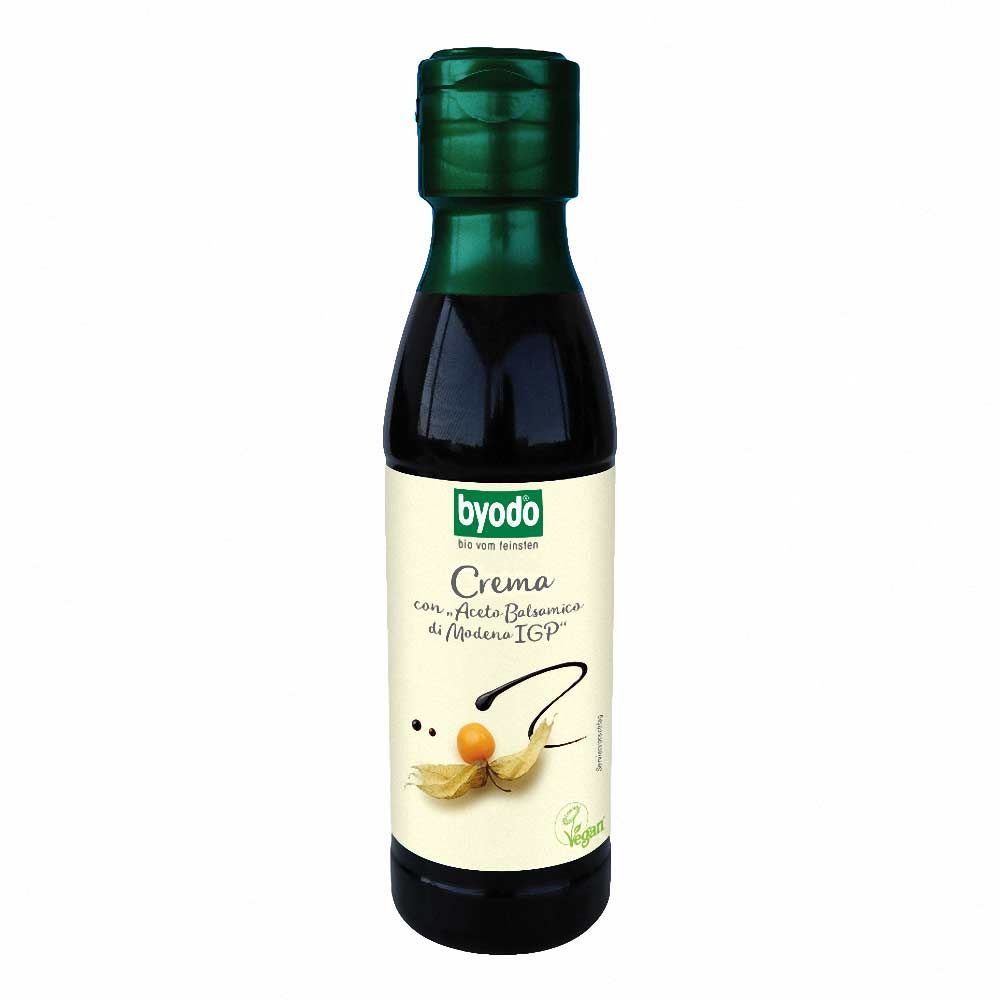 Flasche mit dunkler Flüssigkeit. Aufschrift: Byodo, Crema con Aceto Balsamico di Modena IGP. Grüner Verschluss.