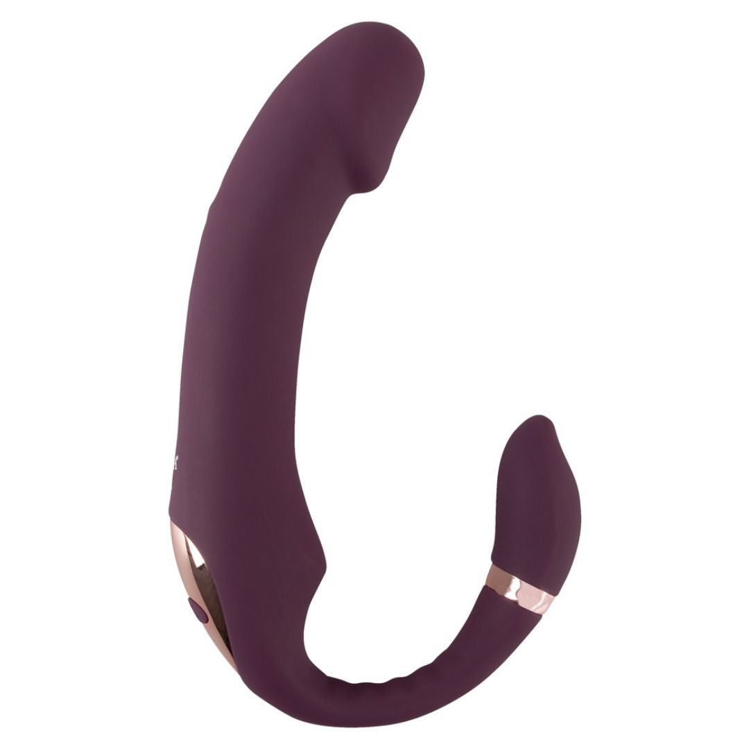 Lila Vibrator mit gebogener Form. Goldfarbene Akzente an den Enden. 