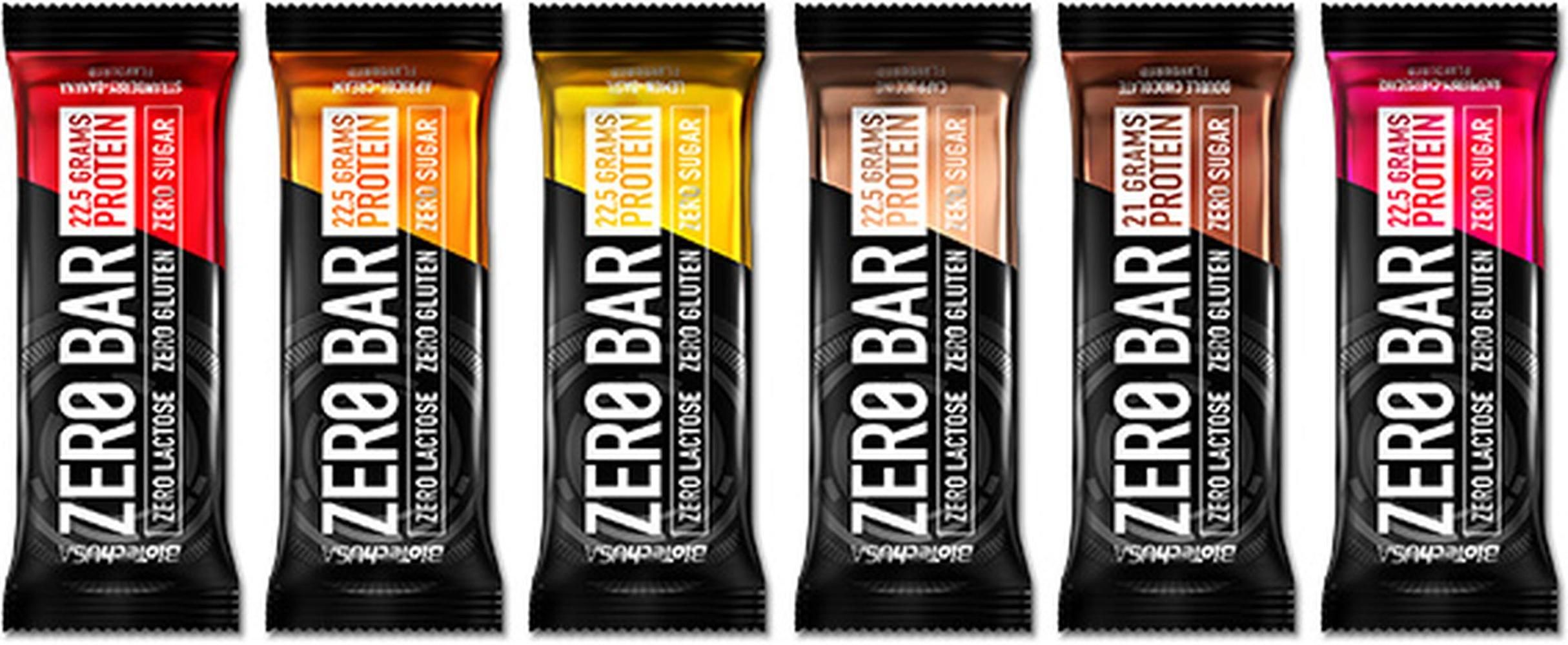 Reihe von sechs Proteinriegeln. Jede Verpackung hat eine andere Farbe. Aufdruck: Zero Bar, 22,5 g Protein, glutenfrei, laktosefrei, zuckerfrei.