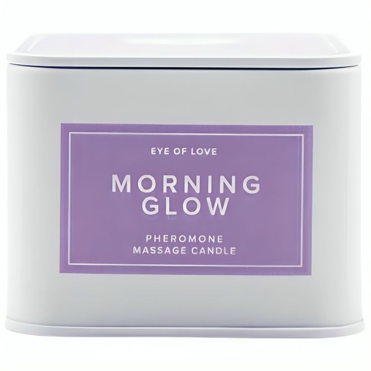Weiße Dose mit lila Etikett, 'Morning Glow Pheromone Massage Candle' von Eye of Love.
