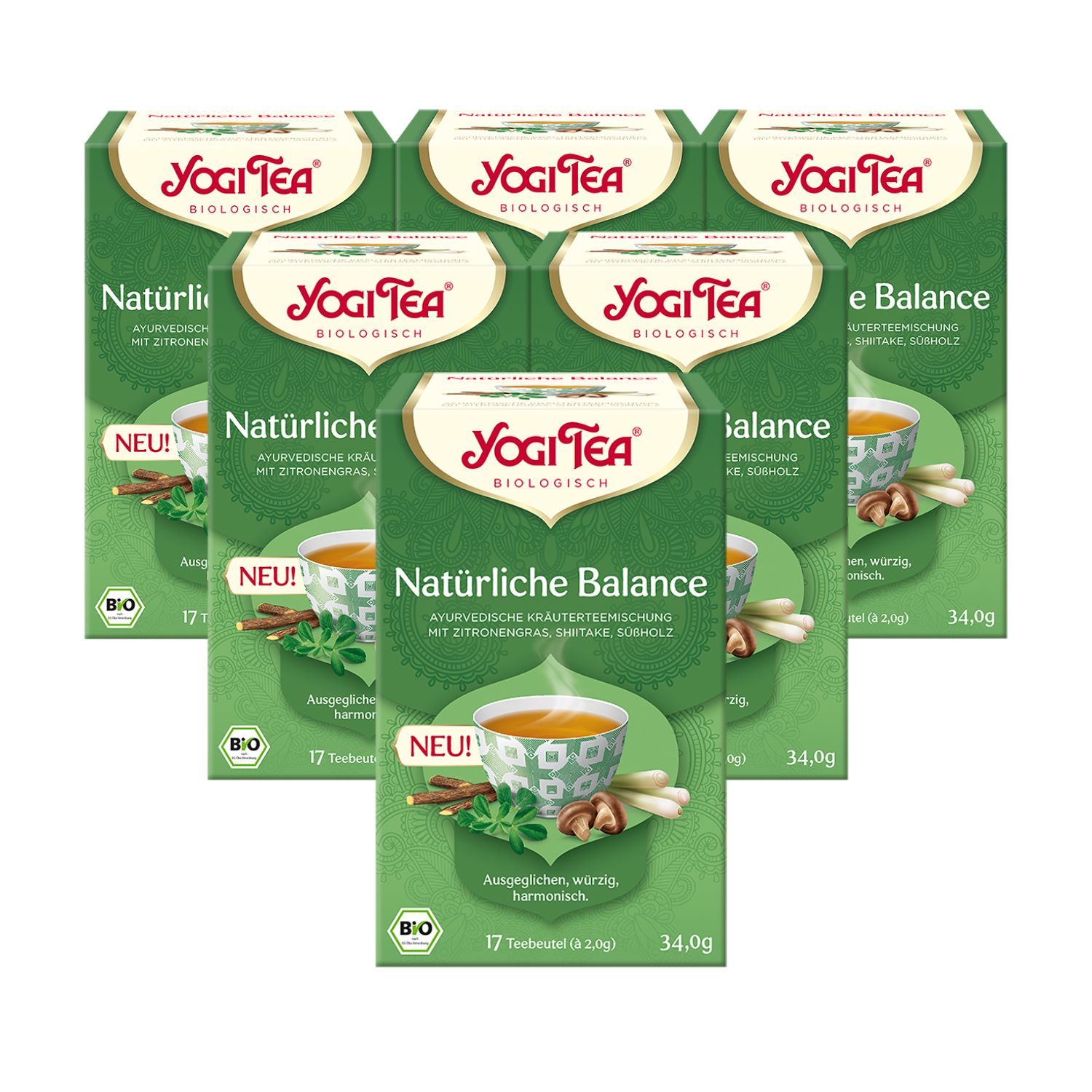 Mehrere grüne Teepackungen mit dem Logo "Yogi Tea". Aufschrift "Natürliche Balance" und "Bio". Abbildung einer Tasse Tee mit Kräutern.