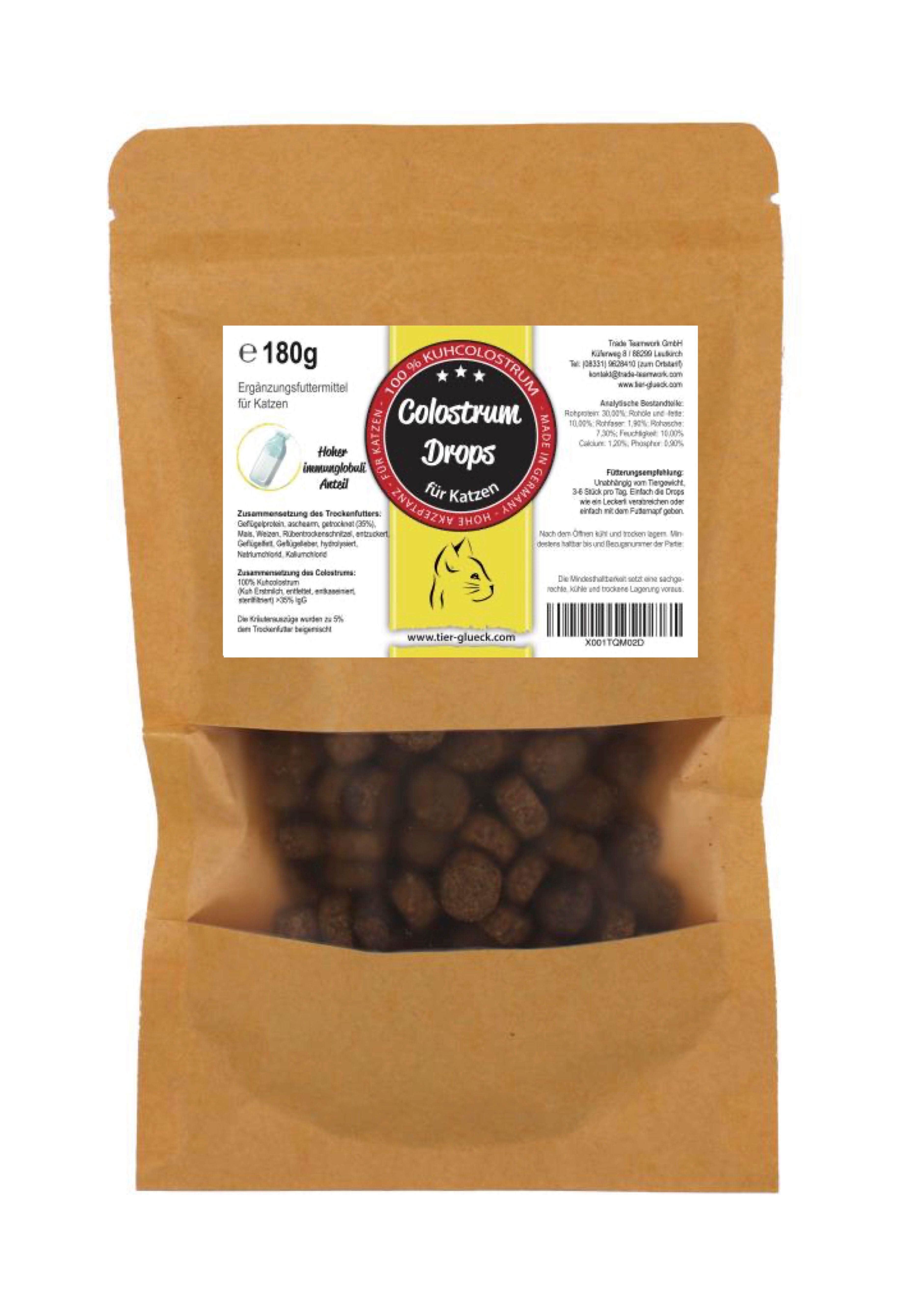 Braune Papiertüte mit Sichtfenster. Colostrum Drops für Katzen, 180g. Produktbezeichnung und Inhaltsstoffe auf Etikett.