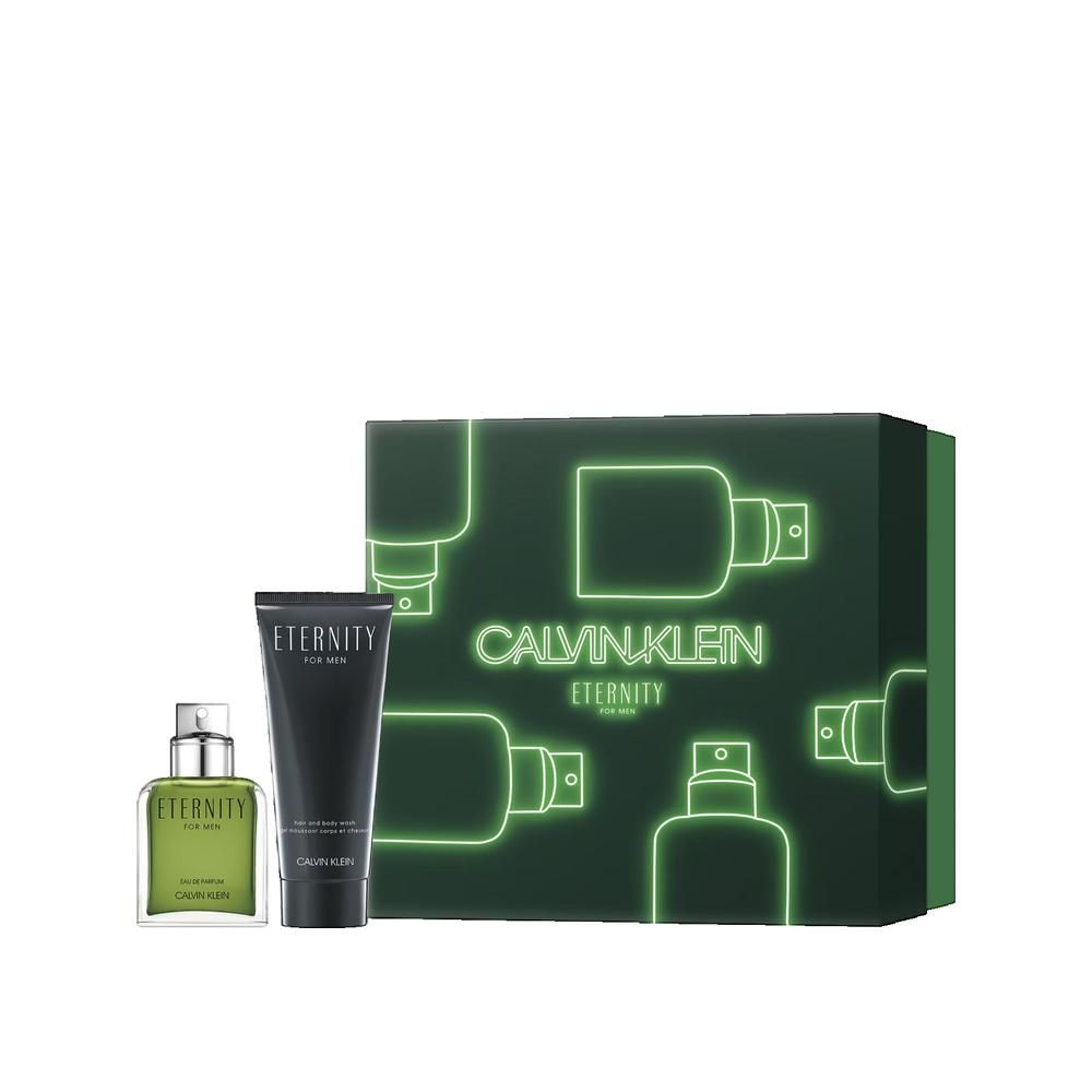 Geschenkset mit Flakon, Tube und Verpackung. Aufschrift Calvin Klein Eternity. Grün-schwarze Verpackung mit Duftflakon-Umrissen.