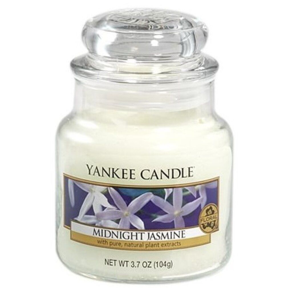 Duftkerze im Glas mit Deckel. Aufkleber mit Blumenmotiv und Schriftzug Midnight Jasmine. Marke: Yankee Candle. Floral-Siegel.