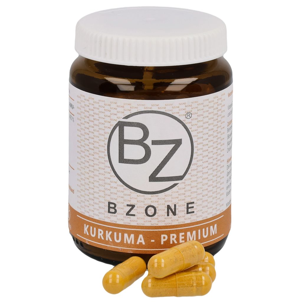 Braune Glasflasche mit weißen Deckel. Aufschrift BZONE, Kurkuma-Premium. Gelbe Kapseln liegen daneben.