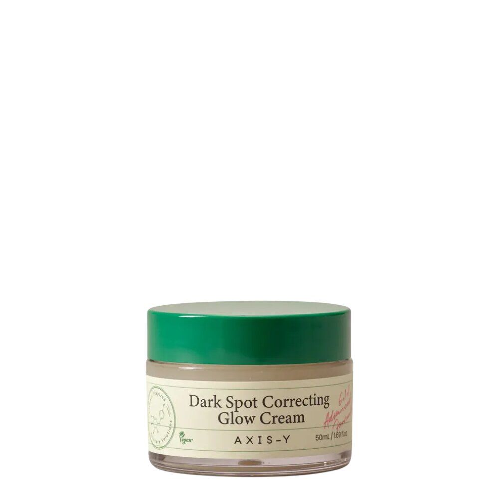 AXIS-Y Dark Spot Correcting Glow Cream in einem Glasbehälter mit grünem Deckel.