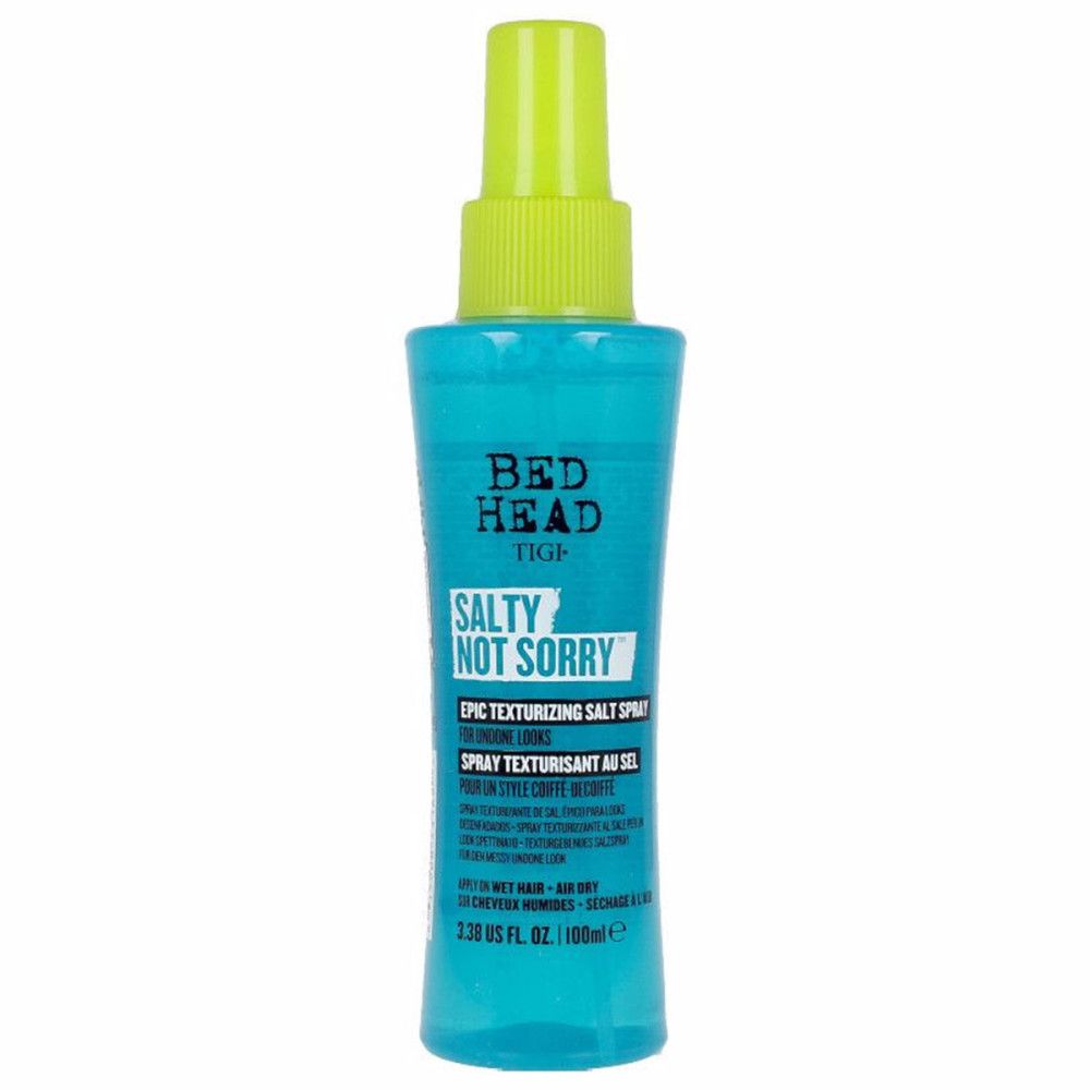 Türkisblaue Sprühflasche mit grünem Sprühkopf. Aufschrift: Bed Head Tigi Salty Not Sorry Epic Texturizing Salt Spray.