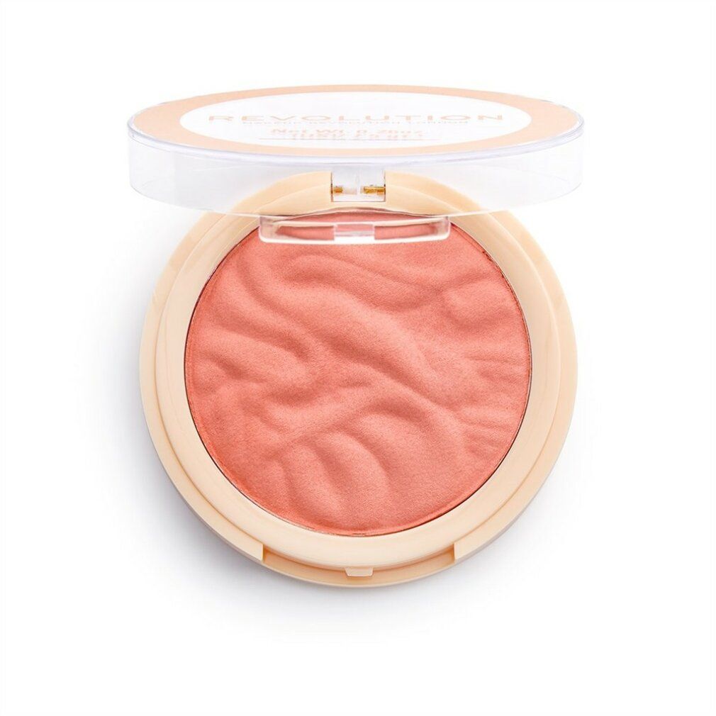 Runder, pfirsichfarbener Blusher von Revolution, geöffnet. Deckel mit Text. Produkt sichtbar.