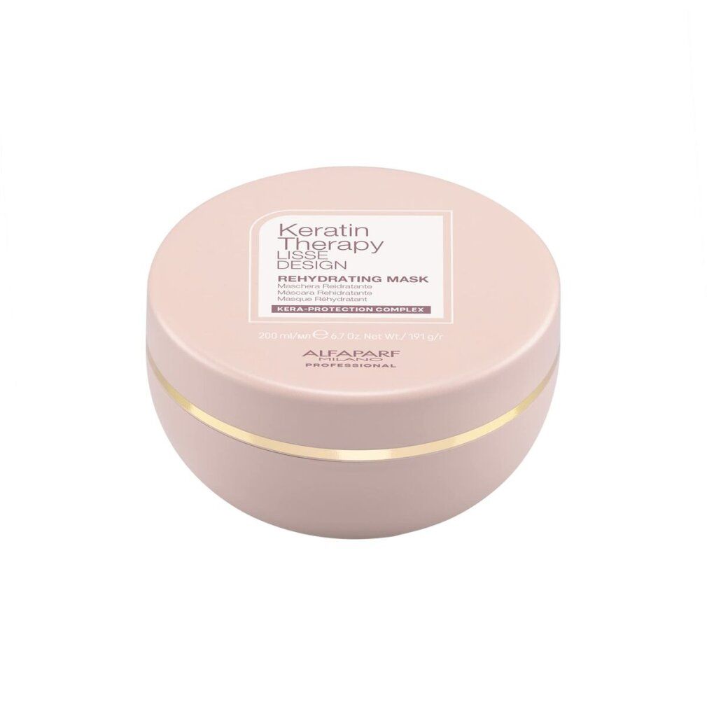 Runde, rosafarbene Dose mit Keratin Therapy Lisse Design Rehydrating Mask. Enthält KERA-PROTECTION COMPLEX.