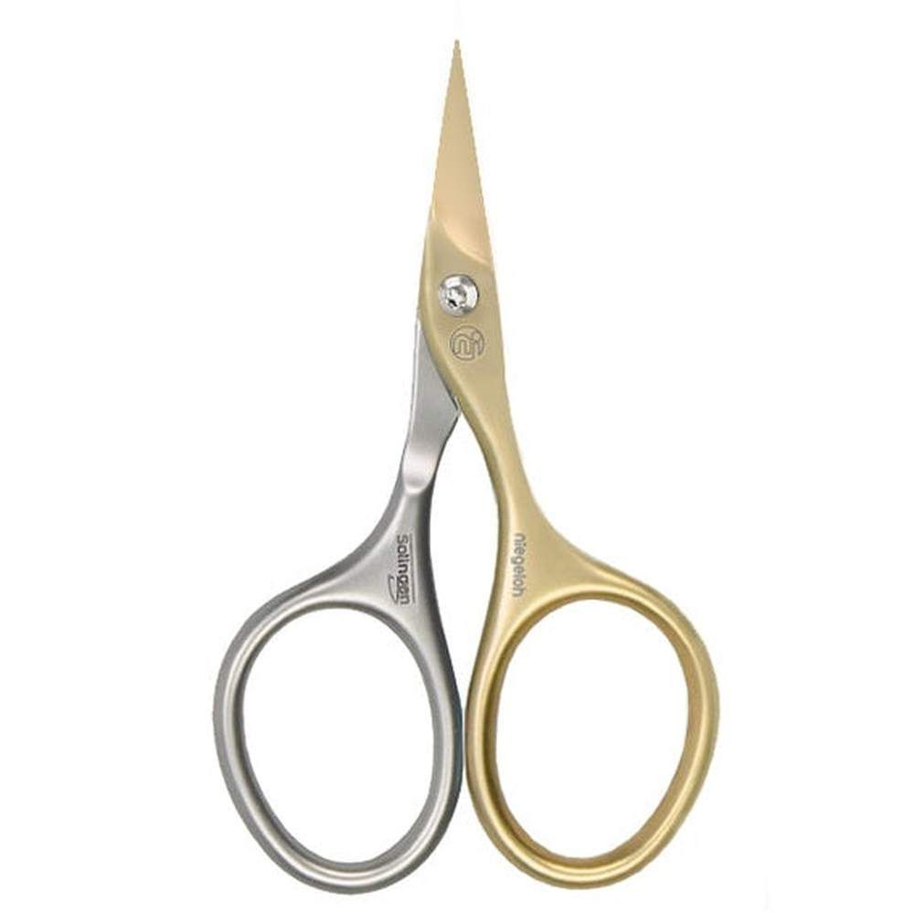 Nagelzange mit goldfarbenen und silberfarbenen Griffen. Auf den Griffen sind die Marken Solingen und Niegeloh zu sehen.