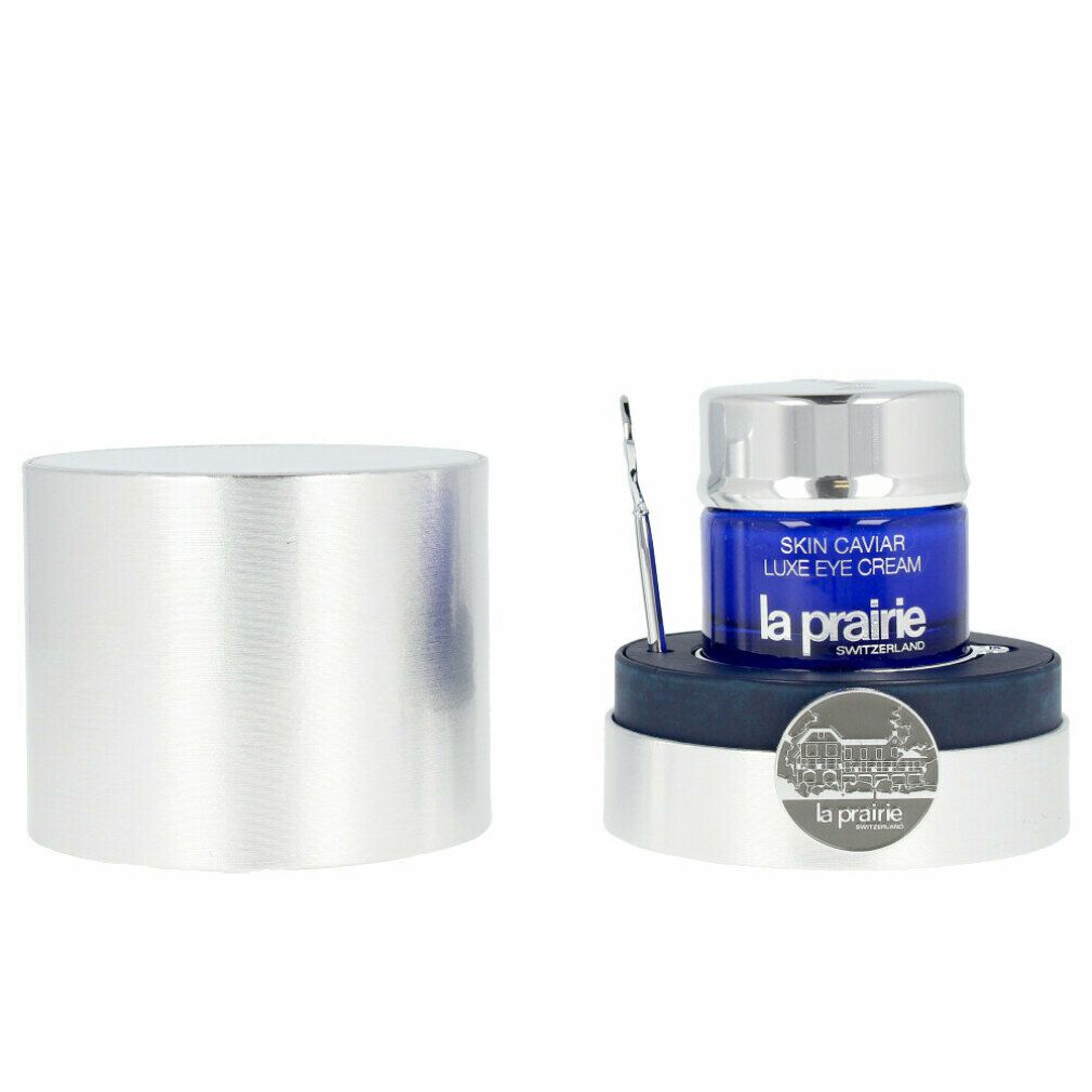 Blaues Glas mit silbernem Deckel und Spatel. Aufschrift: Skin Caviar Luxe Eye Cream, La Prairie.