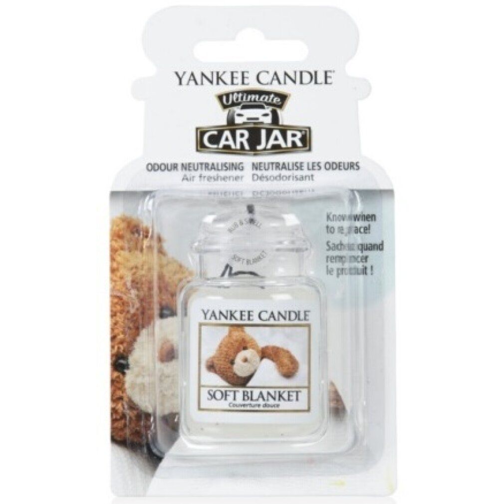 Lufterfrischer im Glasbehälter mit Deckel, in Blisterverpackung. Aufschrift: Soft Blanket. Marke: Yankee Candle.