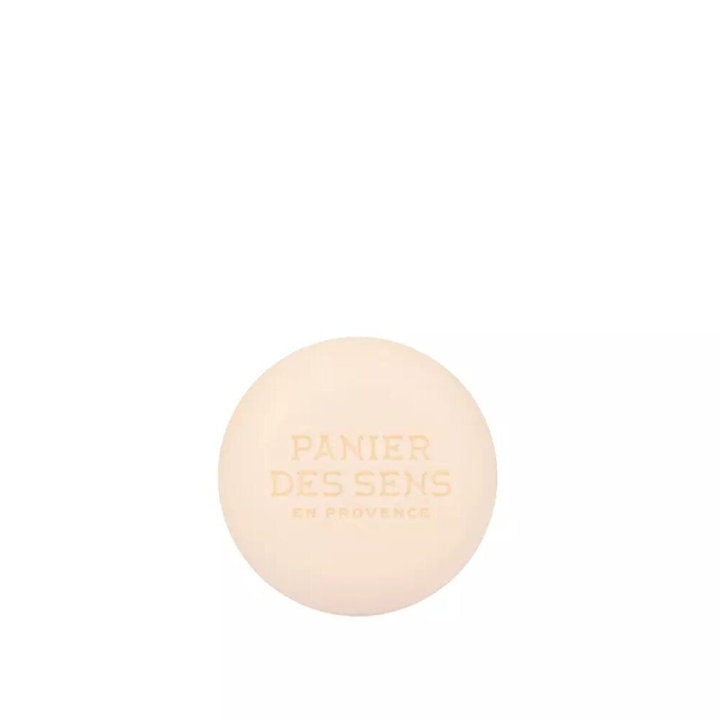 Runder, beigefarbener Shampoo-Bar. Geprägt mit "Panier des Sens en Provence".