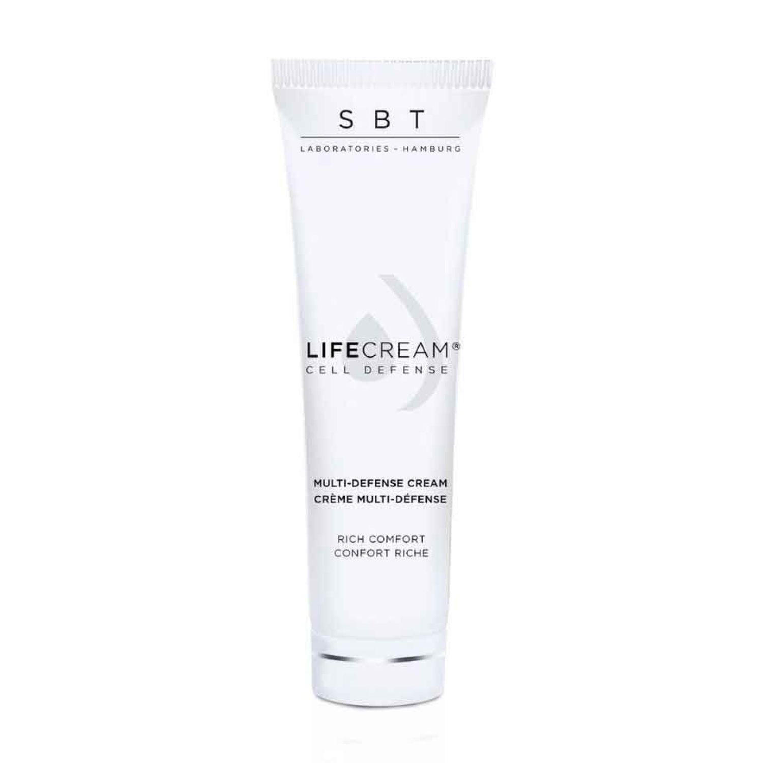 Weiße Tube mit Aufschrift SBT, LIFECREAM CELL DEFENSE. Text: Multi-Defense Cream, Rich Comfort.