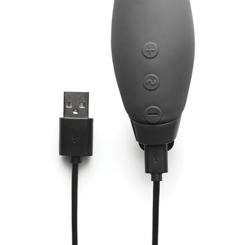 Nahaufnahme eines schwarzen Vibrators mit Ladekabel. Knöpfe zur Steuerung. USB-Anschluss.