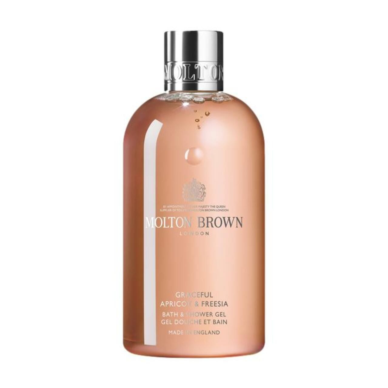 Molton Brown Graceful Apricot & Freesia Bath & Shower Gel. Flasche mit silbernem Deckel. Rosa Flüssigkeit. Text.