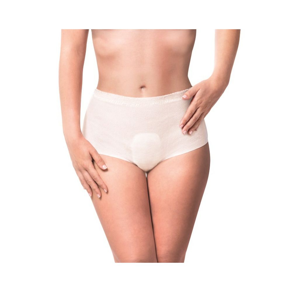 Person trägt beigefarbene iD Intime Pants. Niedrige Taille, Schutzbereich vorne. Angedeutete Passform.
