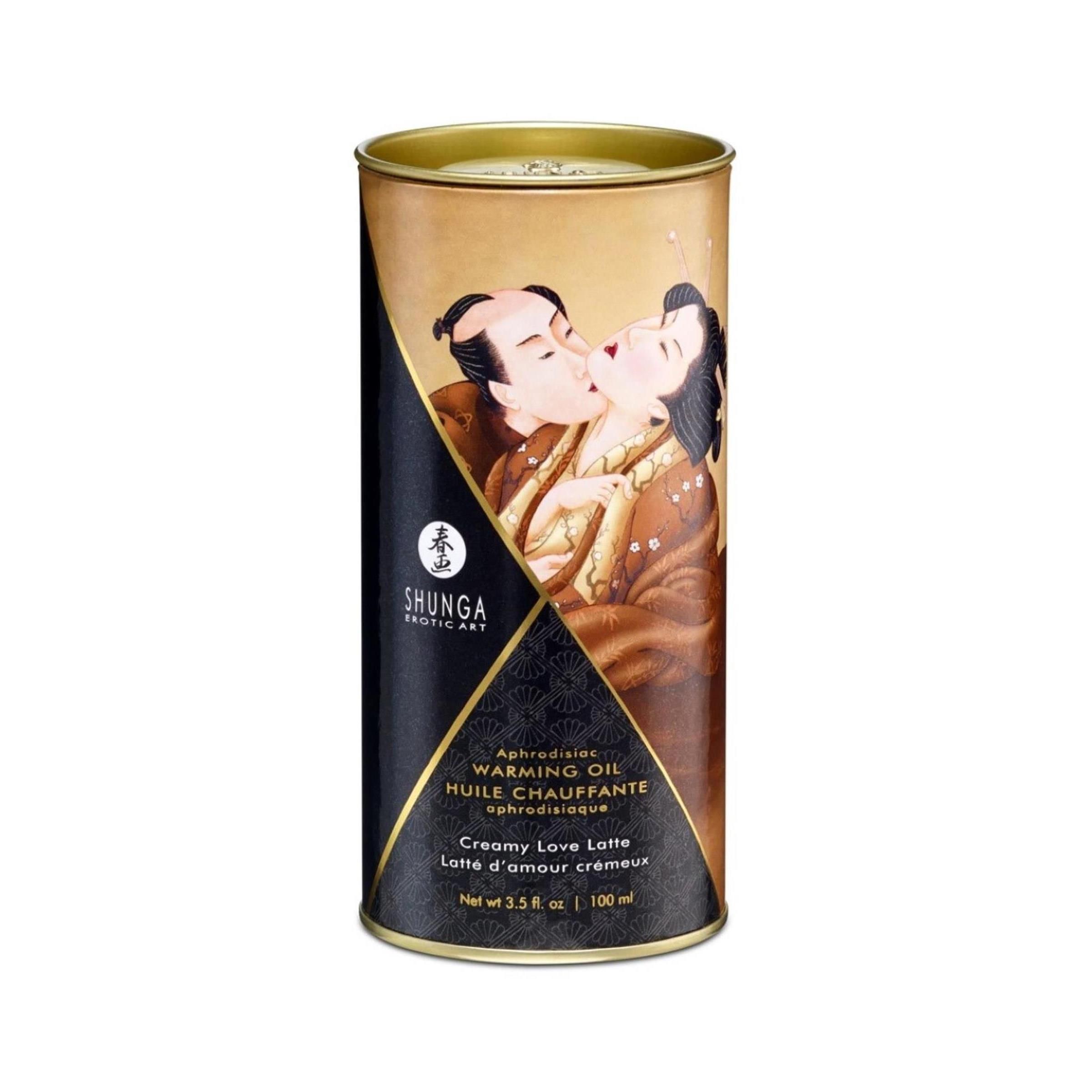 Zylindrische Dose mit Massageöl. Aufdruck mit küssendem Paar. Text: Shunga, Warming Oil, Creamy Love Latte, 100 ml.