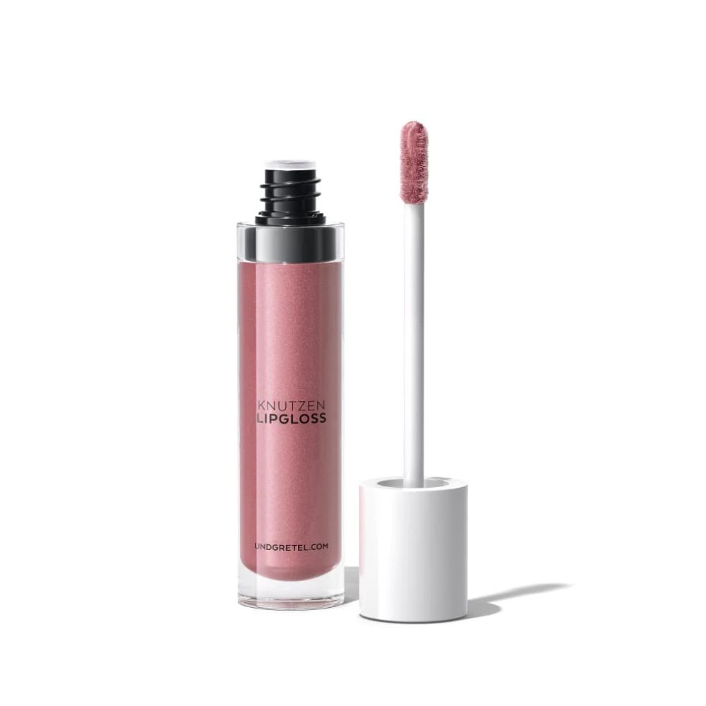 Lipgloss mit Applikator. Farbton: Rosa. Aufschrift: KNUTZEN LIPGLOSS. Marke: UND GRETEL. Flasche aus Glas.