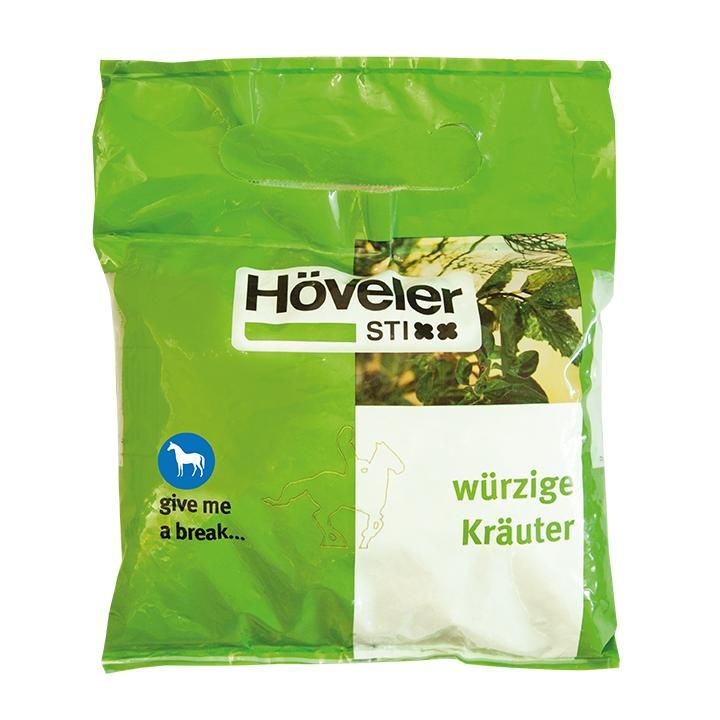 Grüne Verpackung mit Produktnamen Höveler StiXX. Text: würzige Kräuter. Logo mit Pferd. Transparente Verpackung.