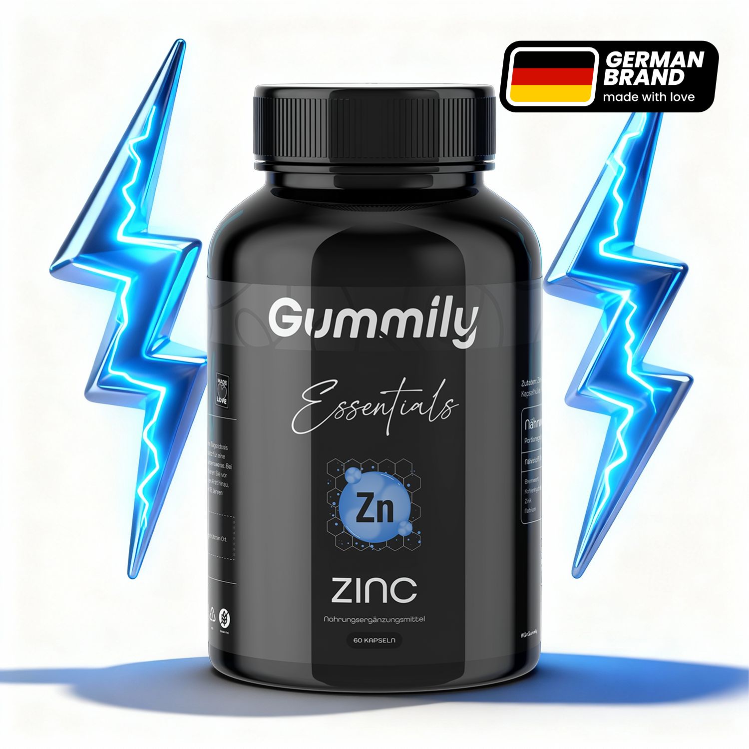 Schwarze Flasche mit Gummily Essentials Zink Kapseln. Deutsches Markenlogo. Blitz-Grafik.