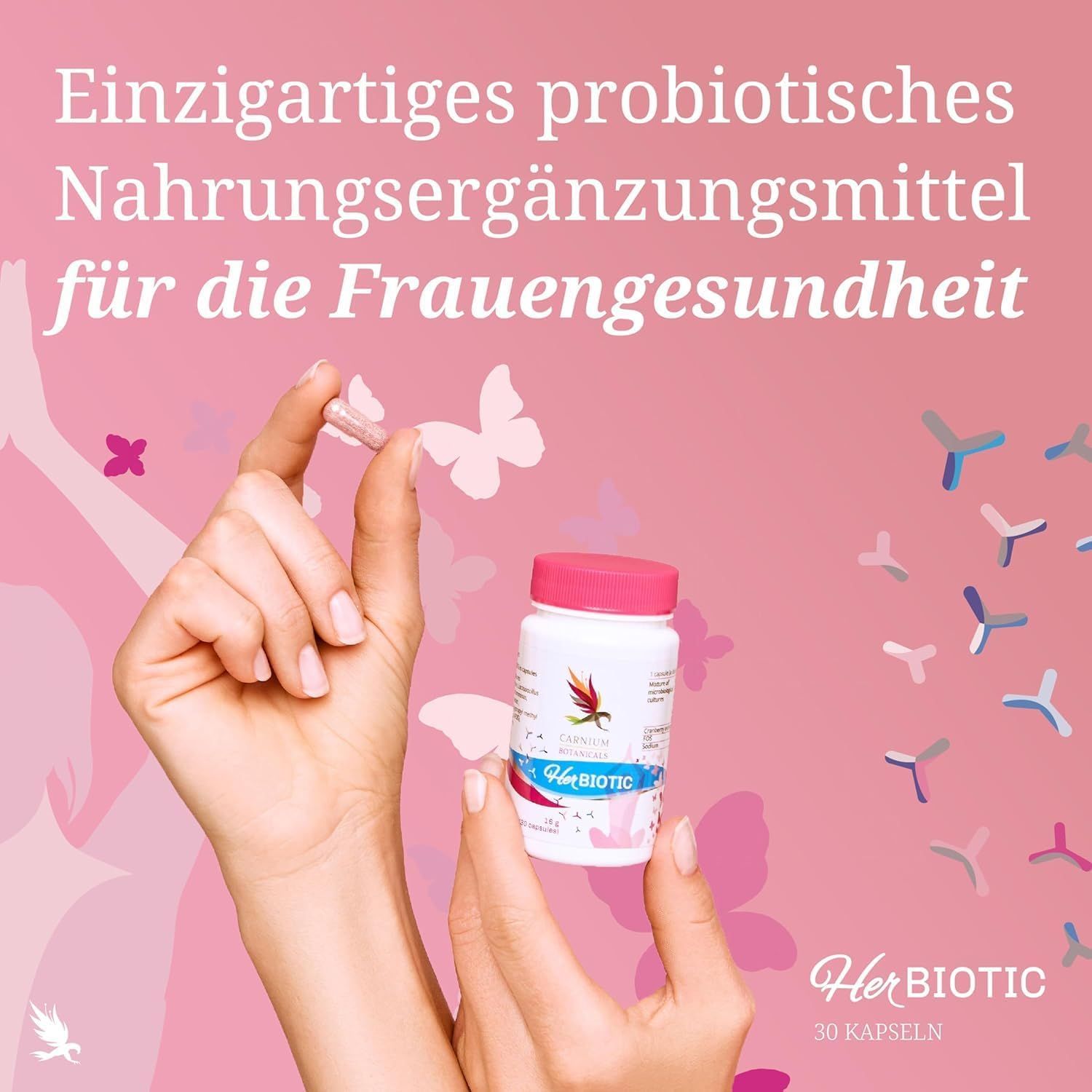 Hände halten Kapsel und HerBiotic-Flasche. Pinker Hintergrund. Text: Nahrungsergänzungsmittel für Frauengesundheit. 30 Kapseln.