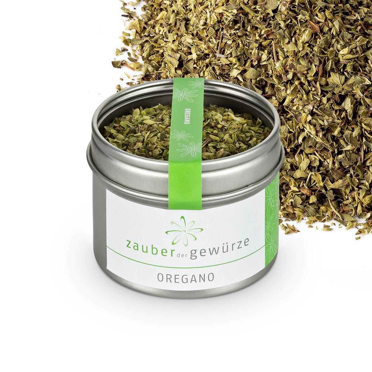 Metallbehälter mit Oregano und Oregano-Haufen daneben. Aufkleber mit "Zauber der Gewürze" und "Oregano". Grünes Band mit "Vegan".