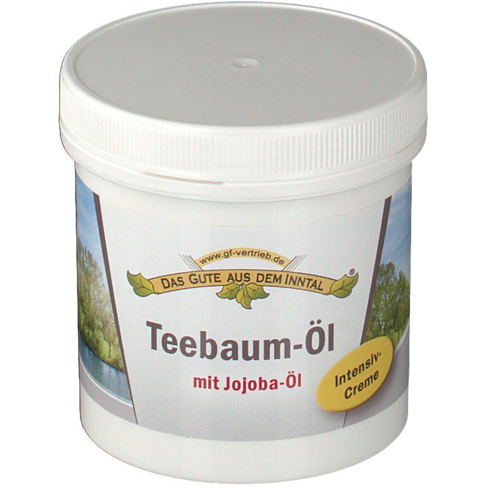 Weißer Tiegel mit Deckel. Aufschrift: Teebaum-Öl mit Jojoba-Öl. Gelbes Etikett: Intensiv Creme. Logo: Das Gute aus dem Inntal.