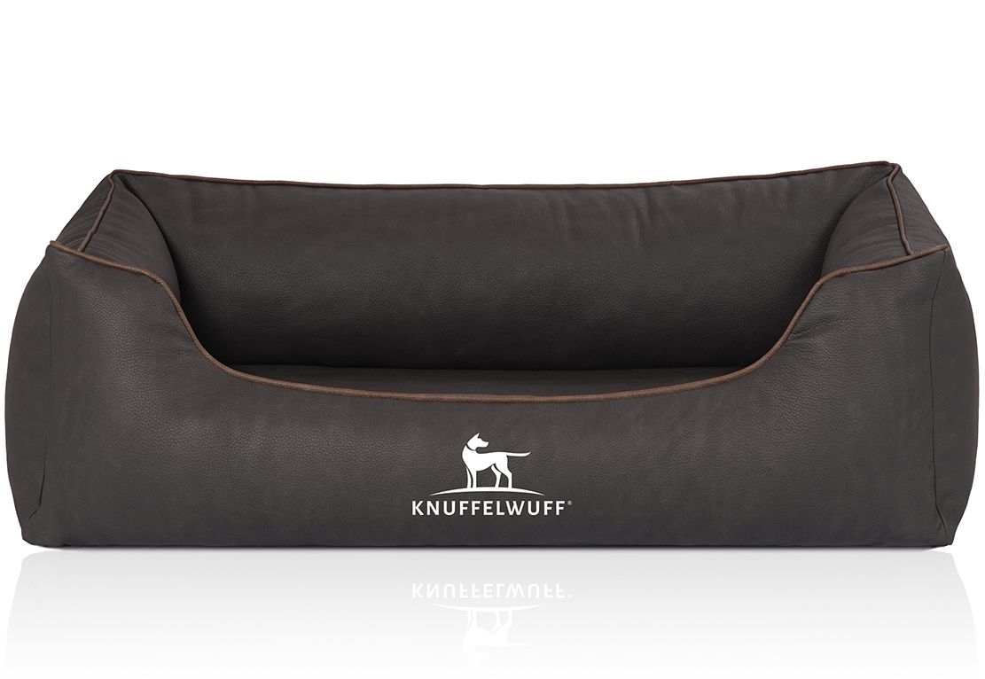 Orthopädisches Hundebett, dunkelgrau mit brauner Kante. Knuffelwuff Logo. Rechteckige Form mit erhöhten Seiten. Reflektierende Oberfläche.