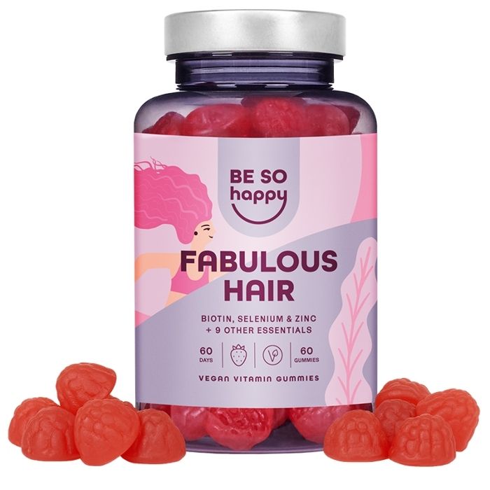 Flasche Be So Happy Fabulous Hair vegane Vitamin-Gummibärchen mit 60 Stück. Umgeben von roten Gummibärchen.
