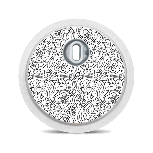 Runder Aufkleber mit floralem Muster in Schwarz-Weiß. Mit weißem Rand und Öffnung in der Mitte.