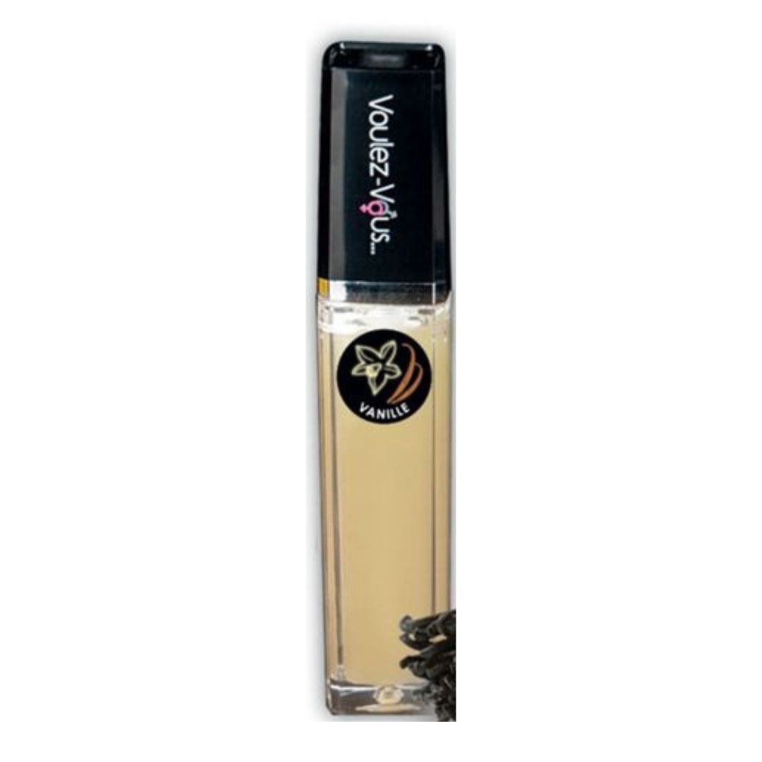 Lipgloss-Flakon mit schwarzem Deckel. Aufschrift: Voulez-Vous. Etikett mit Vanille-Logo. Inhalt: hellbraun.