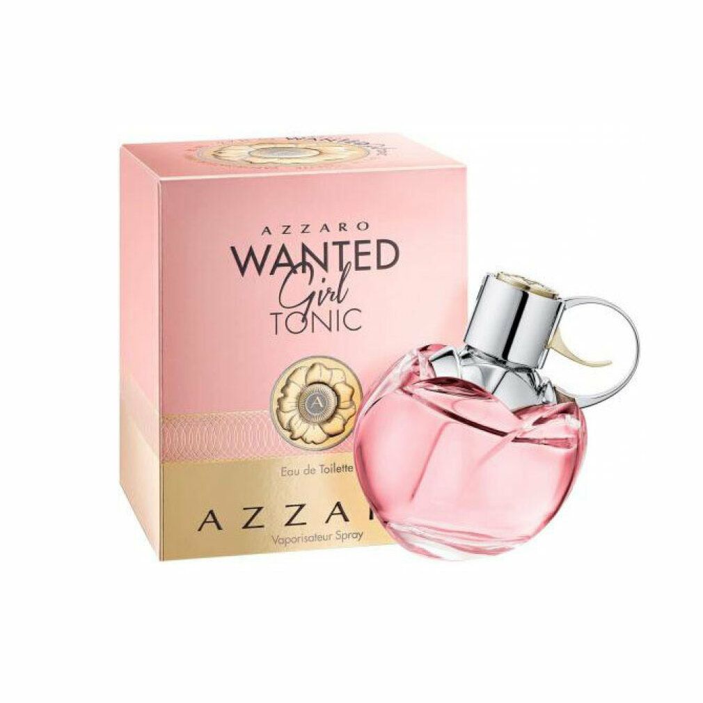 Azzaro Wanted Girl Tonic Eau De Toilette Spray. Rosa Flakon in Granatenform, silberner Verschluss. Rosa Verpackung mit Produktnamen.