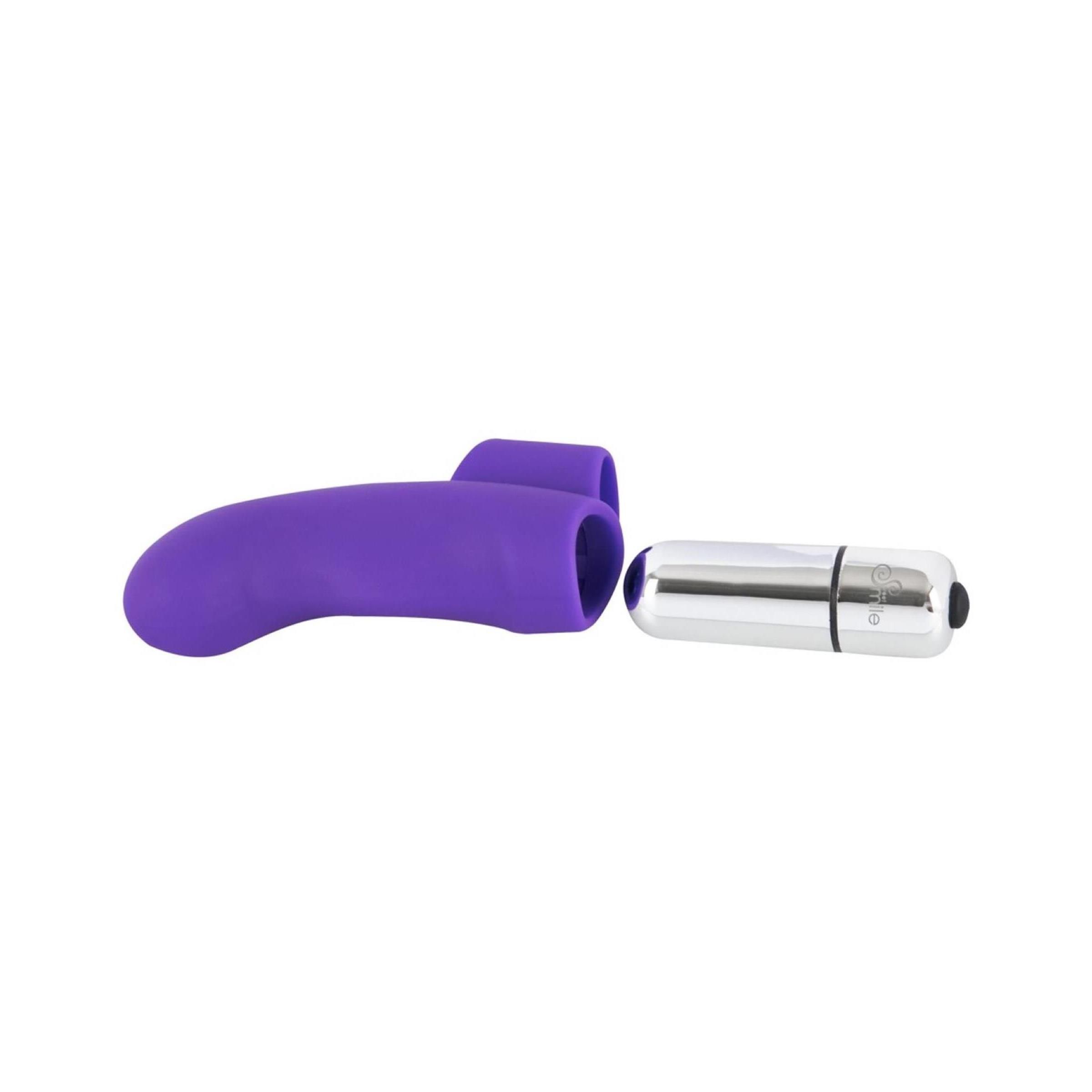 Lila Finger-Vibrator und silberfarbener Vibrationskopf. Ringförmige Basis. Schwarzer Knopf. Einzelteile.