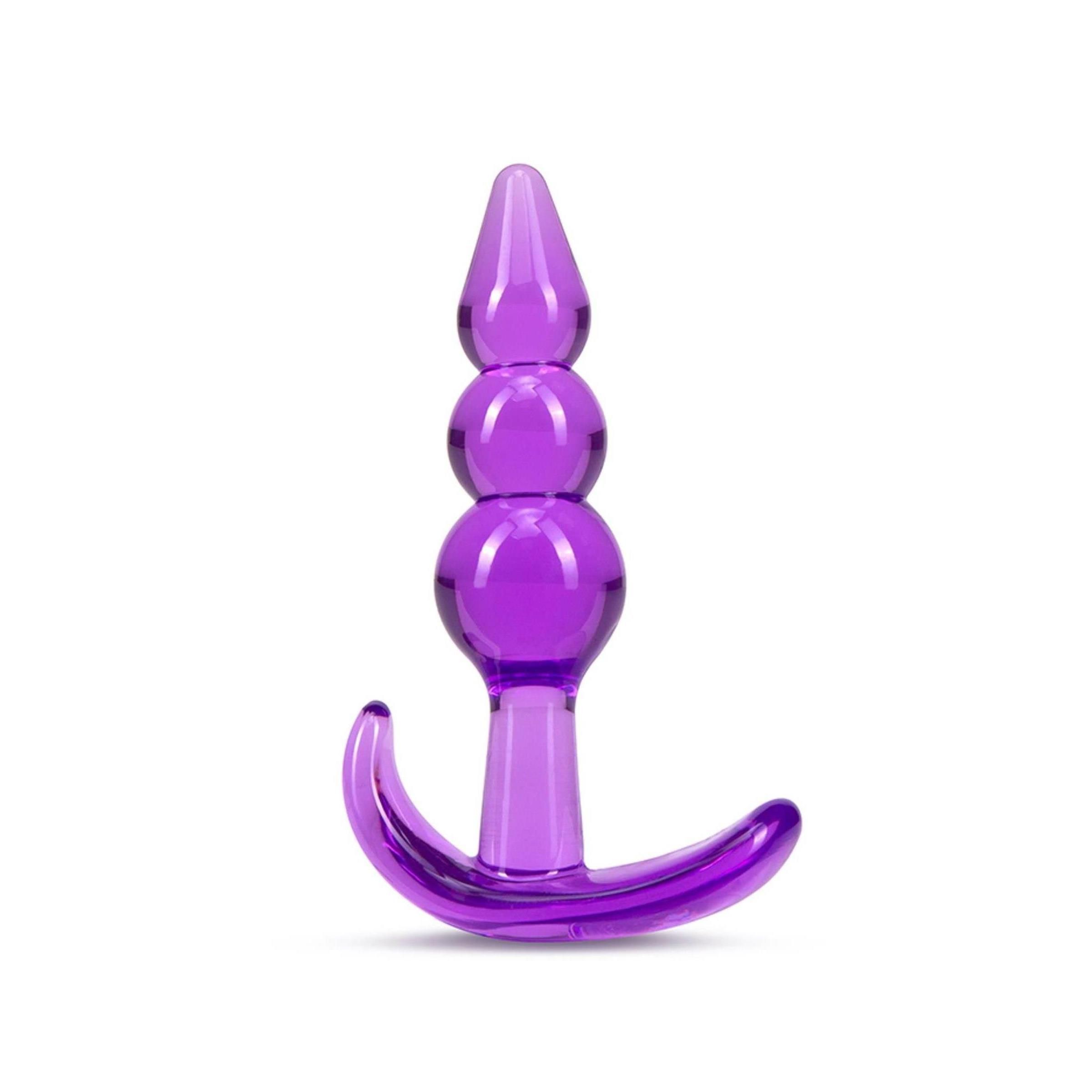 Lila Analplug mit drei Kugeln und gebogener Basis. Aus transparentem Material.