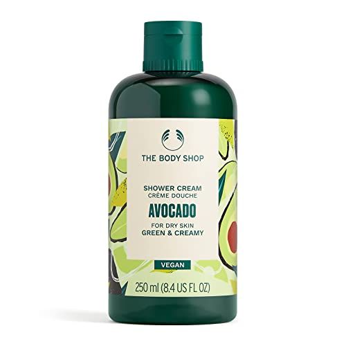 Grüne Duschcreme-Flasche mit Avocado-Motiv. Aufschrift: The Body Shop, Avocado, für trockene Haut, vegan. 250 ml.