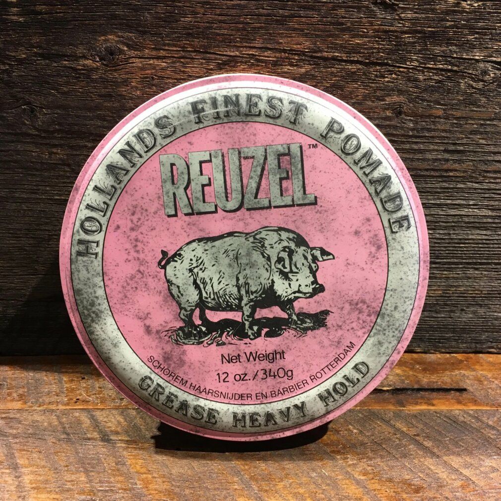 Runde Dose, rosa Deckel. Reuzel-Schriftzug, Schweine-Illustration, Text. 12 oz./340g. Auf Holzuntergrund.