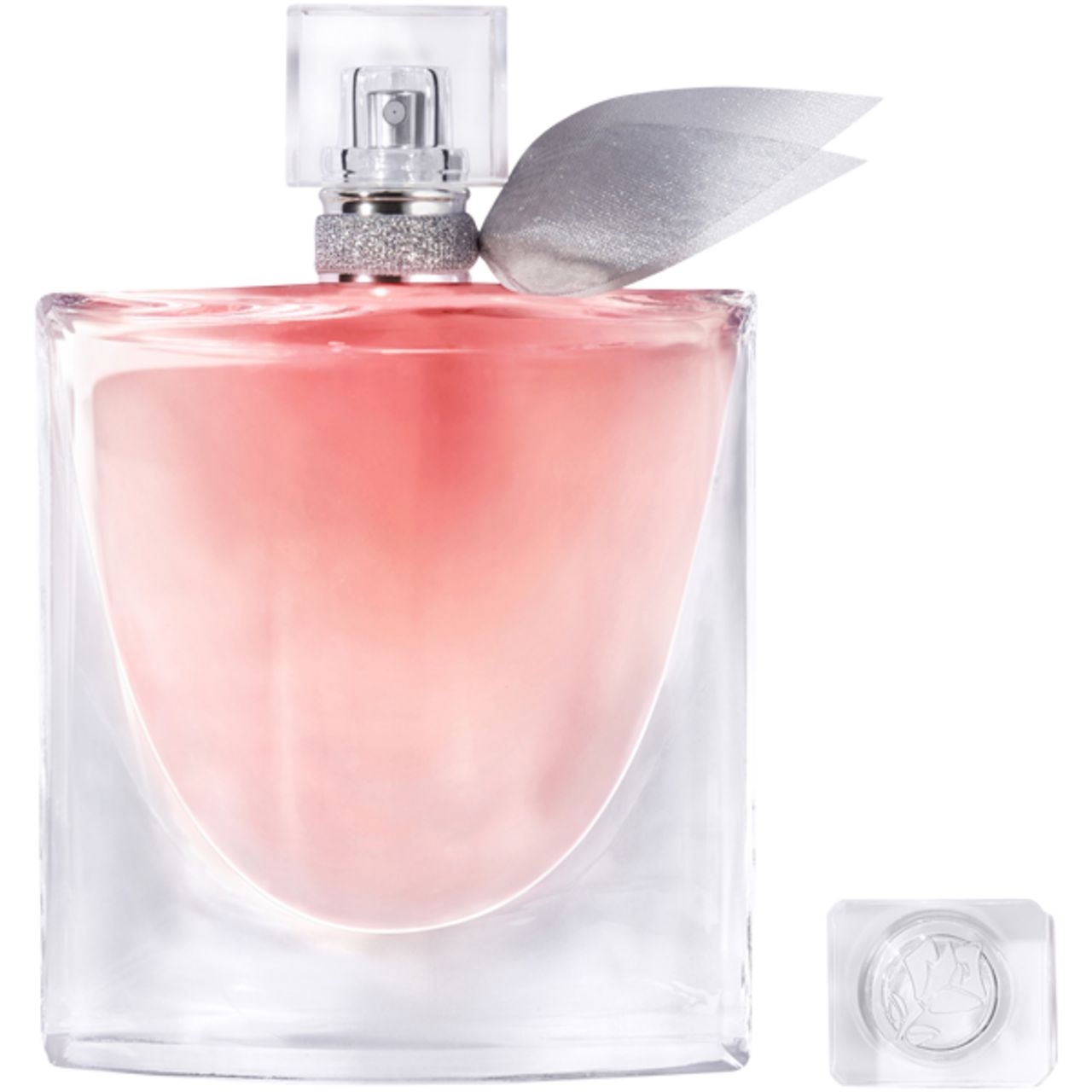 Parfümflakon mit rosa Flüssigkeit, quadratisch, mit silberner Schleife und Deckel daneben. Transparenter Glasflakon.