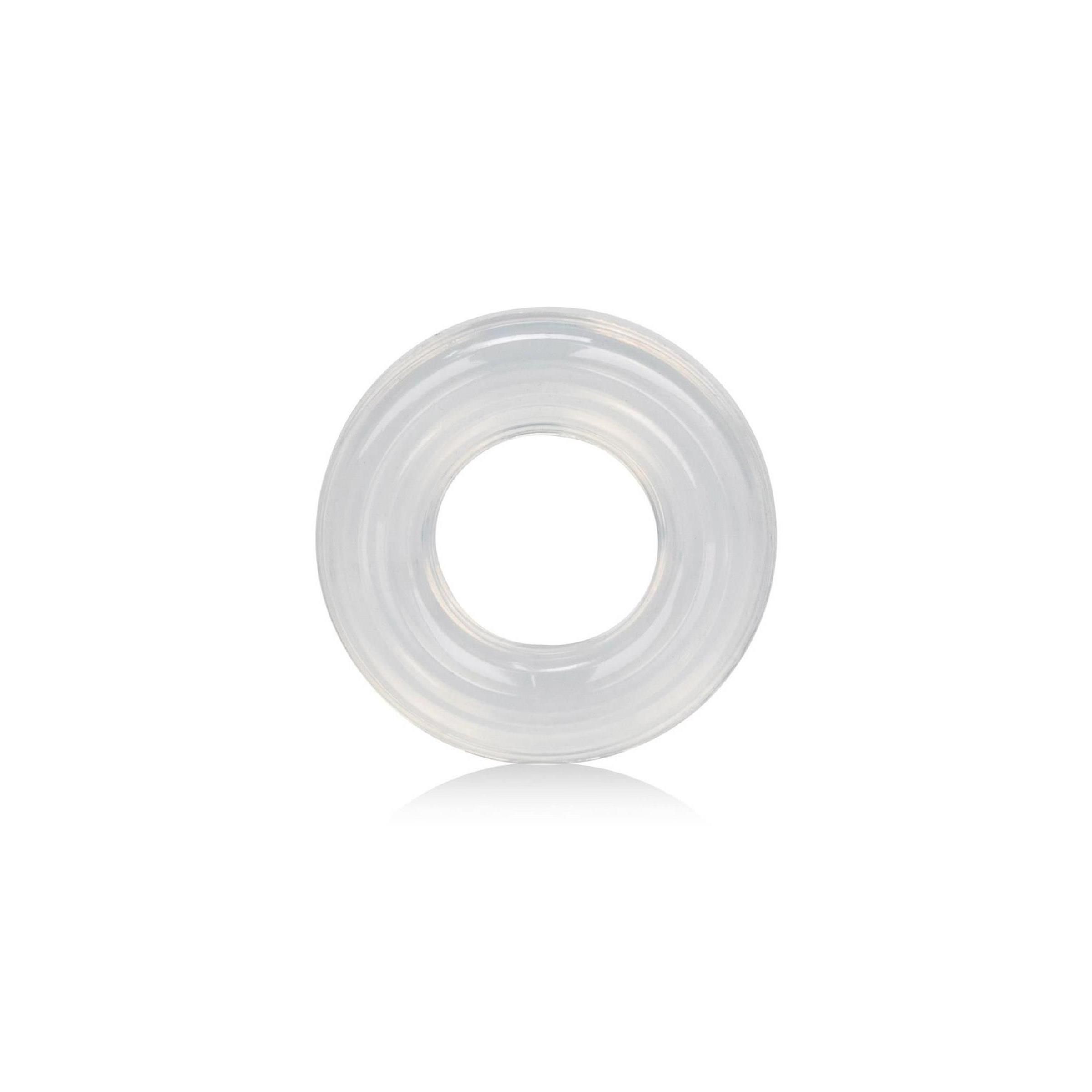 Transparenter Silikonring mit geriffelter Oberfläche. Ringförmig, mit zentralem Loch. Auf weißem Hintergrund.