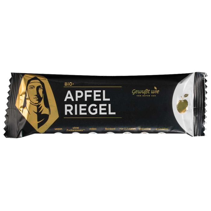 Verpackung eines Apfel Riegels. Schwarze Folie mit goldfarbenem Logo und Schriftzug. Aufschrift: Apfel Riegel, Bio.