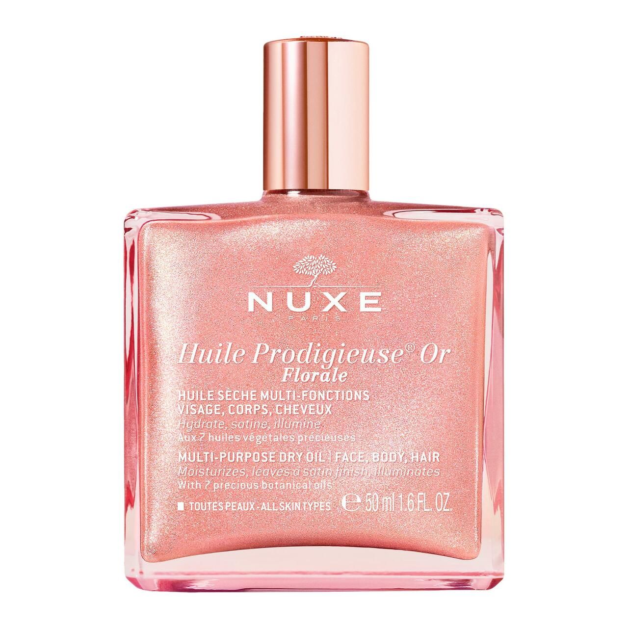 Nuxe Huile Prodigieuse® Or Florale. Rosa Flasche mit goldfarbenem Verschluss. Text auf der Flasche.