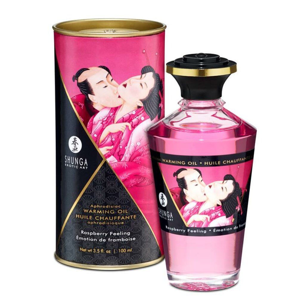 Frambozen massageolie met verpakking. Fles en doos met illustraties. Opschrift: Shunga, Warming Oil.
