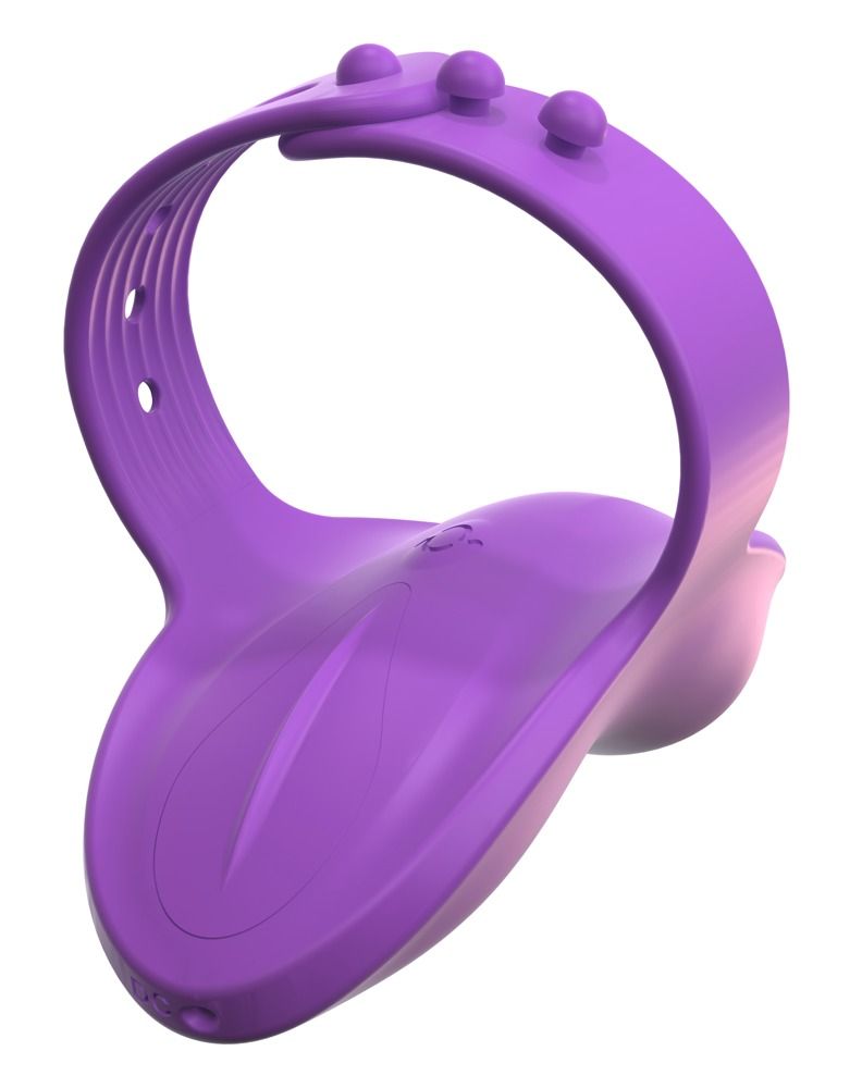 Lila Finger-Vibe. Ringförmiger Teil mit drei Erhebungen und Löchern. Unterteil mit abgerundeter Form.