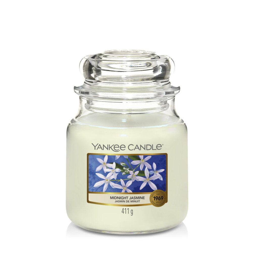 Yankee Candle Midnight Jasmine Duftkerze. Glasbehälter mit Deckel. Etikett mit Blumenmotiv und Produktnamen.