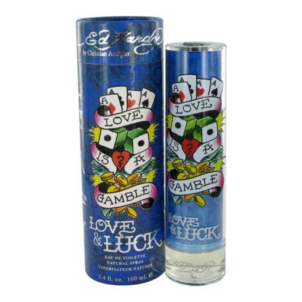 Blaues Eau de Toilette mit zylindrischer Verpackung. Aufschrift: Love & Luck, Ed Hardy. Tattoo-Design mit Spielkarten und Würfeln.
